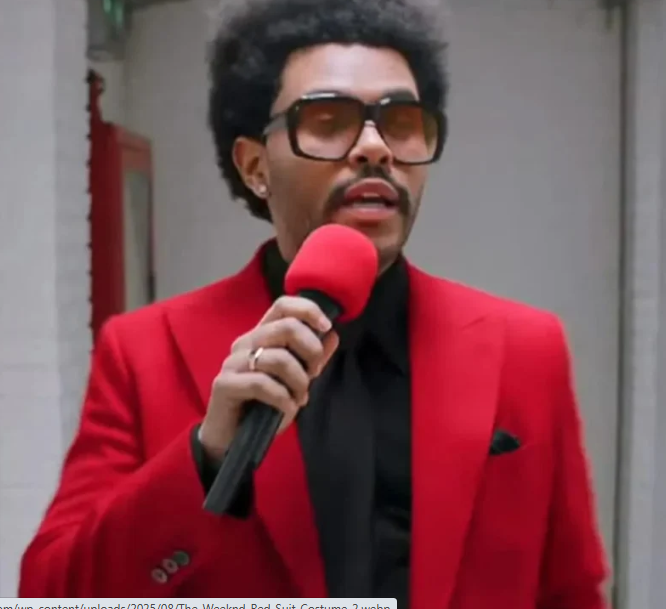 Man wearing weeknd red suit talking on microphone
