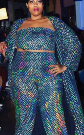 model in a PlatTiQue outfit slacks, crop top and long jacket
