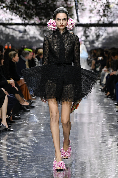 Carol Monteiro walked the runway for Dior’s Haute Couture Spring/Summer 2026 collection, wearing a black sheer mesh A-line tutu dress previously worn by Emily Blunt at the London premiere of “The Devil Wears Prada 2.”