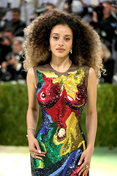 Chase Infiniti attended the 2026 Met Gala in a custom Thom Browne embroidered trompe l’oeil dress inspired by Venus de Milo, which she paired with high jewelry from Marli New York’s Lady Liberty, Twilight, and Cleo by Marli collections.