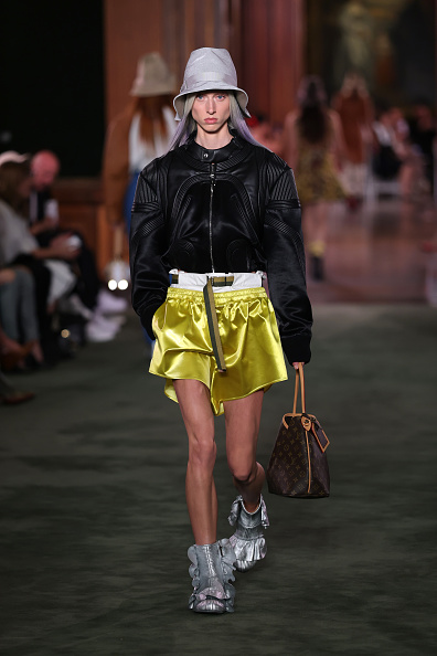 At the Louis Vuitton Cruise 2027 show, a model strode the runway in a bomber jacket paired with layered satin shorts, pulled in at the waist by a slim belt that hung down for effect—an outfit later spotted on Zendaya at the afterparty.