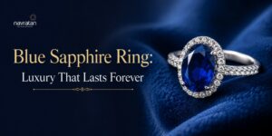 Blue sapphire ring with a diamond halo on dark blue satin; Navratan ad headline 'Blue Sapphire Ring: Luxury That Lasts Forever'.