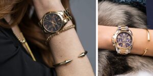 Two wrists display stylish jewelry: a gold-tone wristwatch with matching bracelets on dark fabric, left side close-up.