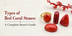 Banner with the title 'Types of Red Coral Stones: A Complete Buyer's Guide' and red coral jewelry on the right.