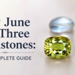 Banner: 'Why June Has Three Birthstones: The Complete Guide' with blue, green, and orange gems and a pearl on a light background.