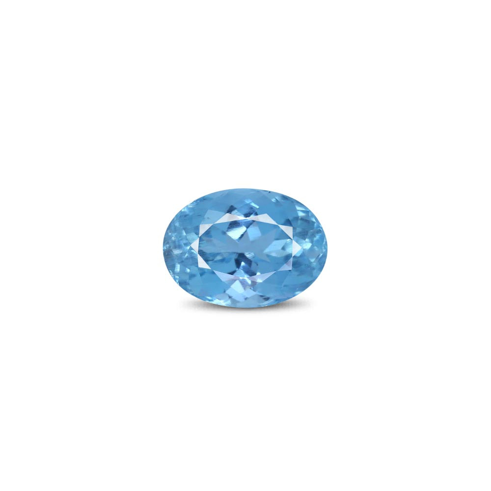 Oval blue aquamarine gemstone with a faceted cut resting on a white background.