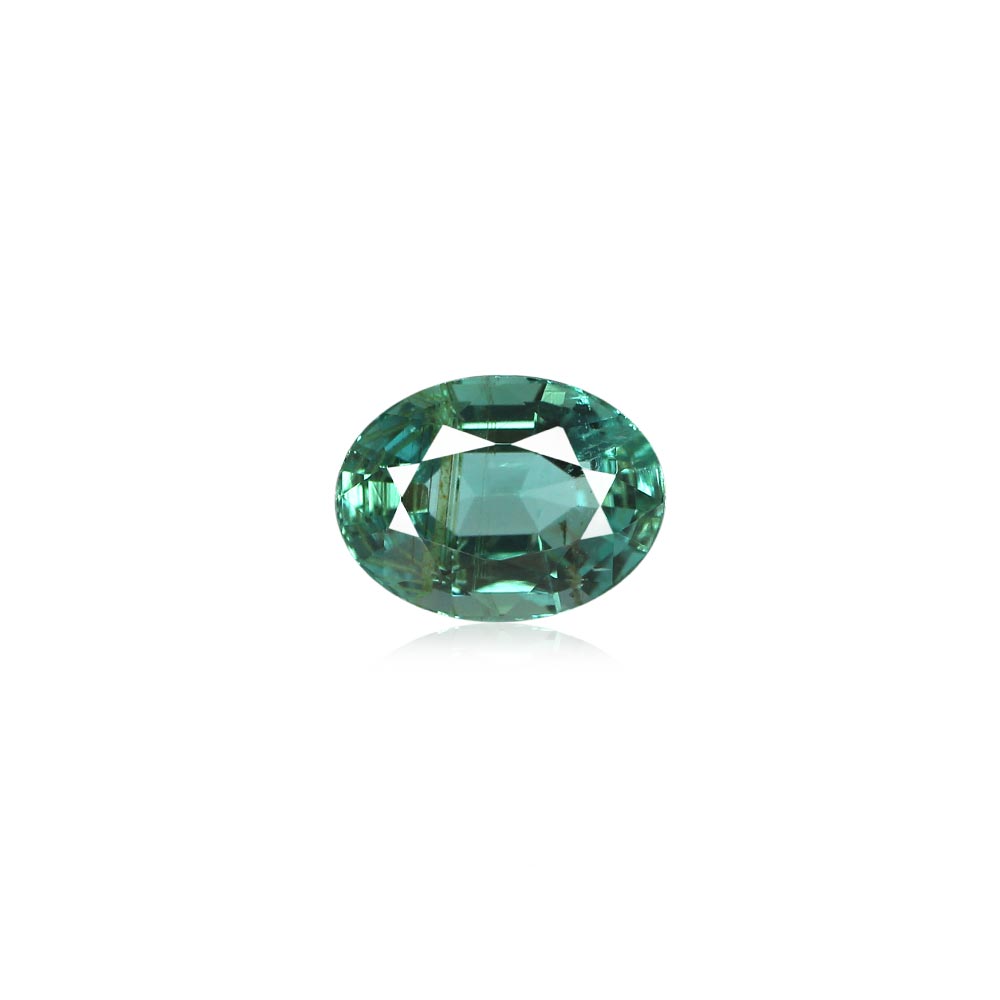 Oval emerald-cut green gemstone with faceted facets on a white background