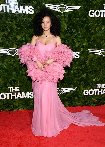 Chase Infiniti attended the 2026 Gotham Television Awards dressed in a custom Louis Vuitton ruffled shawl, a spaghetti strap pleated dress, with Mejuri fine jewelry.