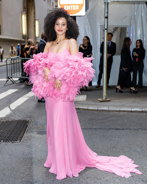 Chase Infiniti attended the 2026 Gotham Television Awards dressed in a custom Louis Vuitton ruffled shawl, a spaghetti strap pleated dress, with Mejuri fine jewelry.