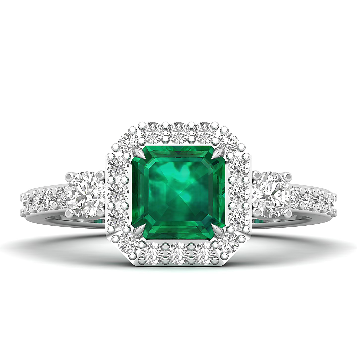 Emerald-cut green emerald center stone surrounded by a double halo of diamonds in a white-gold ring