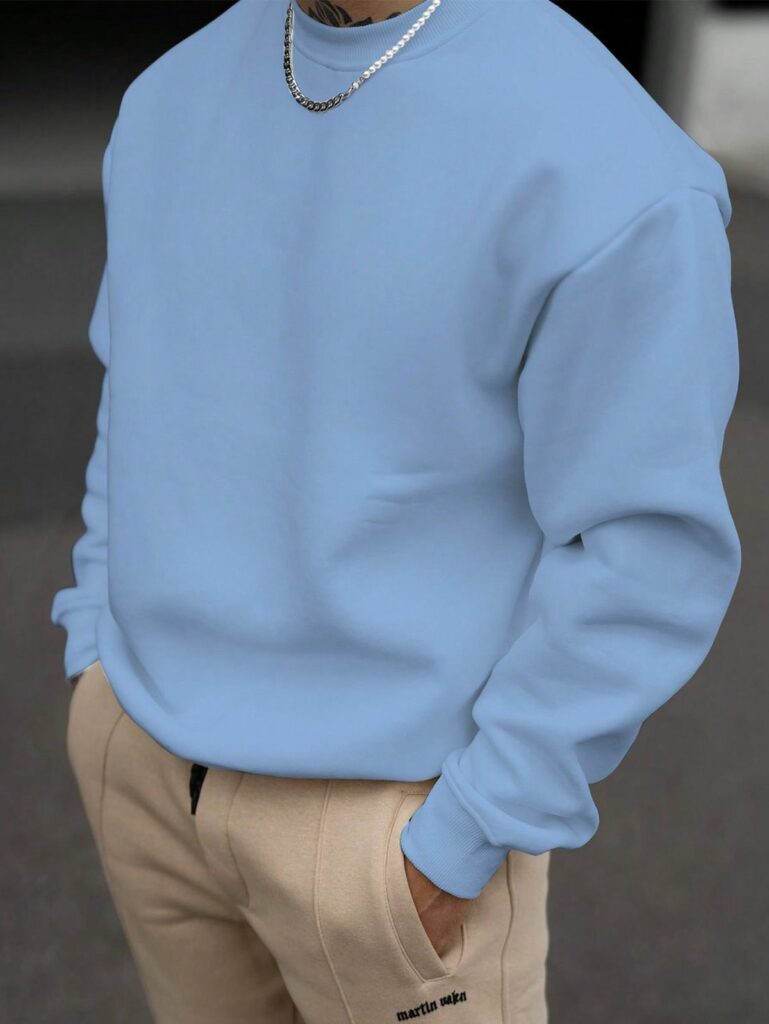 Model in a crewneck sweatshirt.