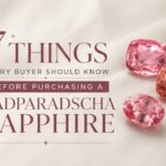 Promotional banner: '7 Things Every Buyer Should Know Before Purchasing a Padparadscha Sapphire' with three pink sapphires on a satin background
