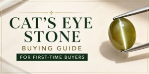 Cat's eye stone being held with tweezers beside a buying guide title for first-time buyers.