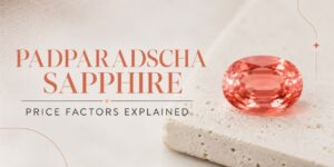 Hero banner with ‘Padparadscha Sapphire’ and ‘Price Factors Explained’ text, featuring a pink‑orange sapphire on a beige textured surface.