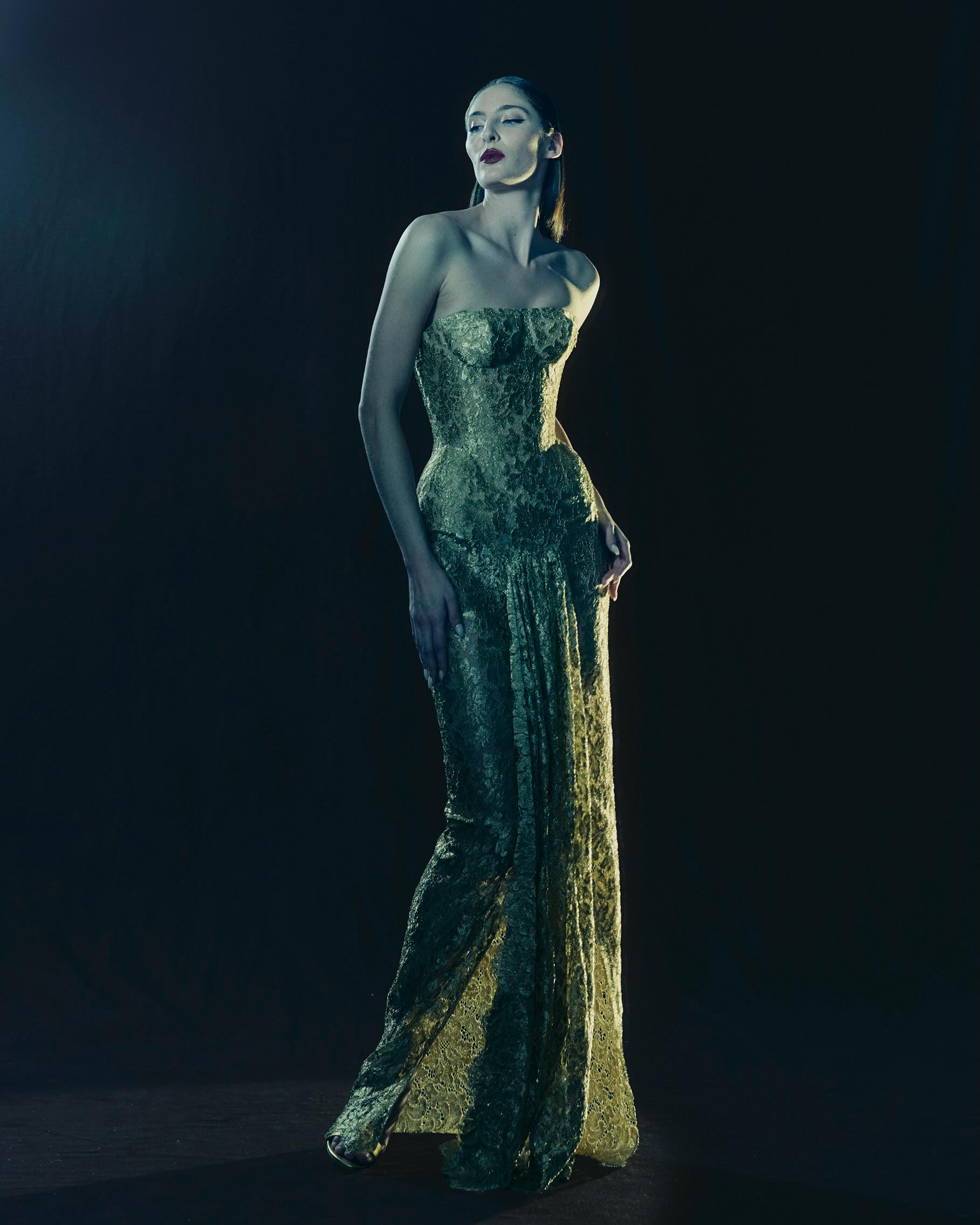 The Nicholas Oakwell Haute Couture Spring/Summer 2026 “Goddess” collection featured a strapless metallic gold lace corset gown with a thigh-high slit—an ensemble also worn by Lupita Nyong’o at the New York premiere of “The Odyssey.”