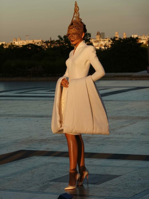 Zendaya attended the Paris photocall for “The Odyssey” at Place du Trocadéro, wearing a vintage 1997 Givenchy Haute Couture sheath dress, Christian Louboutin “So Kate” pumps, and Fope 18-carat gold earrings.