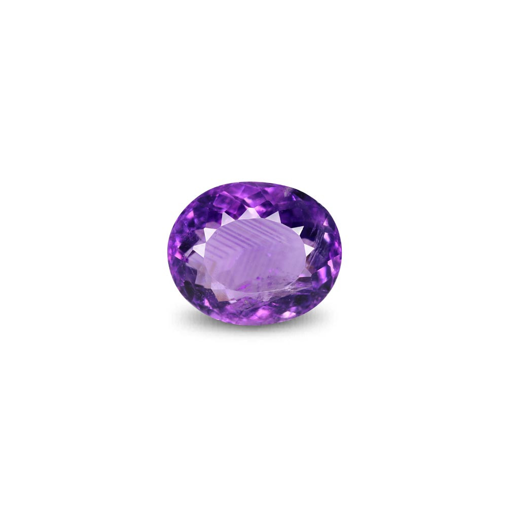 Oval-cut purple amethyst gemstone on a white background