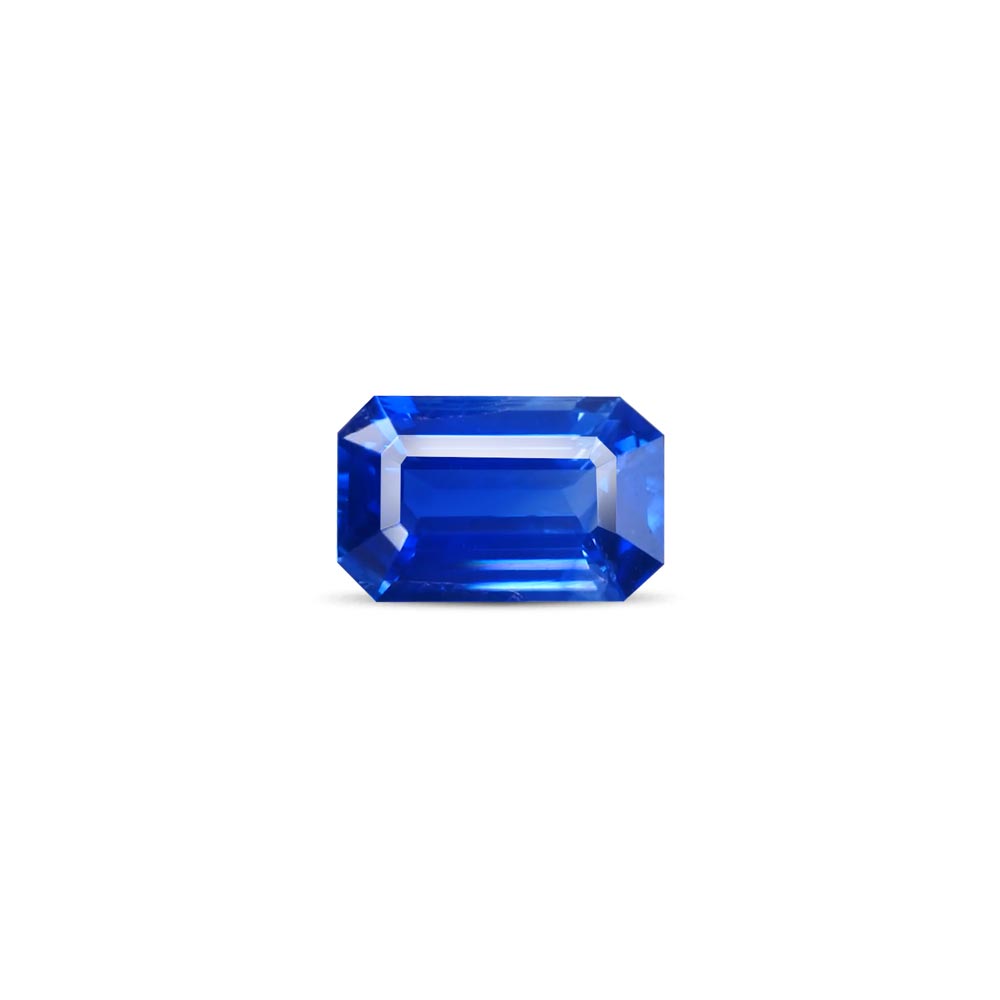Emerald-cut blue sapphire gemstone centered on a white background.