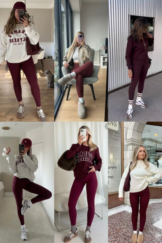 Person wearing burgundy leggings with a white oversized hoodie and burgundy cap, taking a mirror selfie in a bright room with a cat in the background.