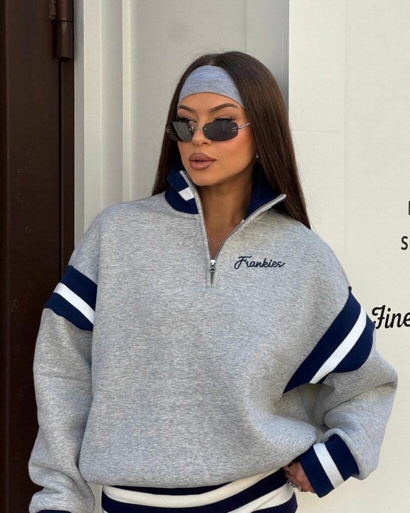 Model in a zip up hoodie 