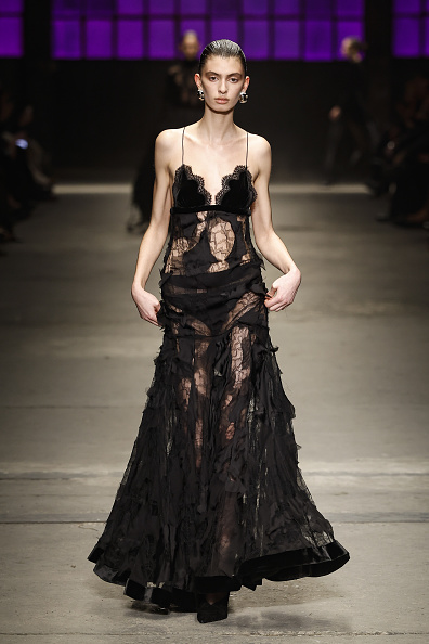 The Roberto Cavalli Fall/Winter 2026/2027 collection featured a sheer lace floral appliqué tulle gown, which was worn by Doechii at the 2026 BET Awards.