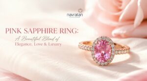 Promotional banner featuring a pink sapphire ring with a diamond halo on pink satin, with the text 'Pink Sapphire Ring' and a logo above.