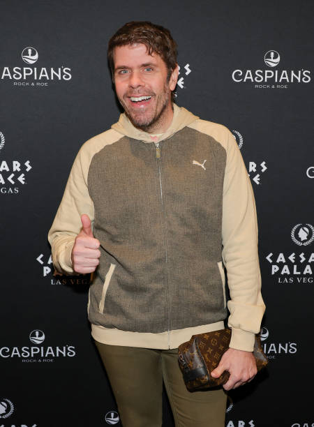 erez Hilton attends the grand opening of Caspian's Cocktails Caviar wearing zip-up Puma Hoodie was blazing, and he paired it with olive trousers.