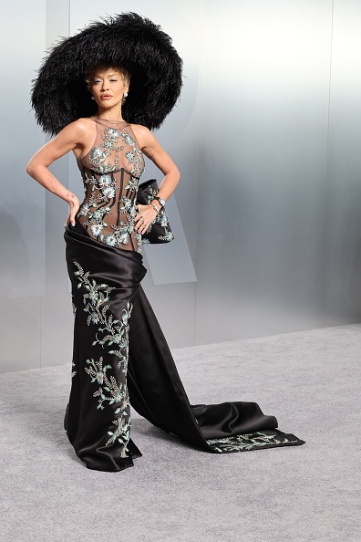 Rita Ora wears a Tamara Ralph Haute Couture black silk double-satin sheer draped gown to the 2026 Vanity Fair Oscar Party hosted by Mark Guiducci.