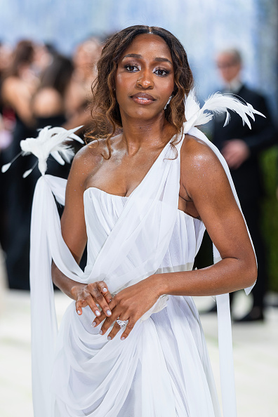Ayo carried a pearlescent white resin and gold-tone metal evening bag from the brand’s Paris Spring/Summer 2026 collection