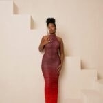 Dawn Ruched in her signature Halter Maxi Dress.