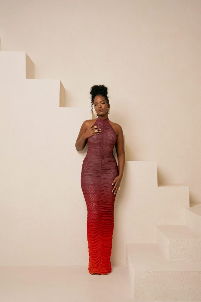 Dawn Ruched in her signature Halter Maxi Dress.