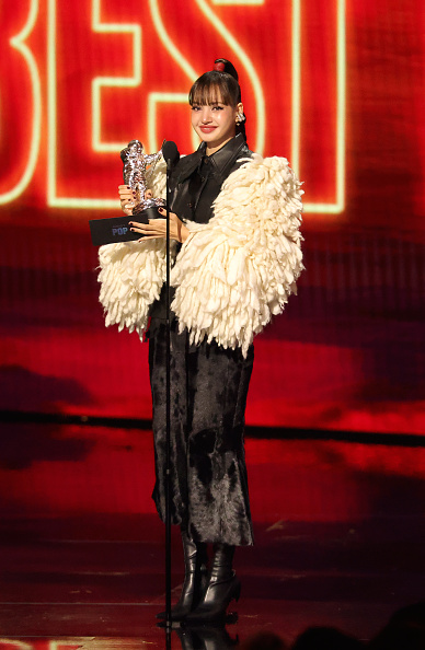 LOS ANGELES, CALIFORNIA - SEPTEMBER 27: Lisa accepts the "Best Pop" Award for “Dream feat. Kentaro Sakaguchi” onstage during the 2026 MTV Video Music Awards (VMAs) at Peacock Theater on September 27, 2026 in Los Angeles, California. (Photo by Kevin Winter/Getty Images)