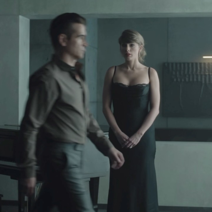 Taylor Swift was spotted filming her “Patient Zero” music video in Staud’s Evangeline cowl-neck silk midi dress.