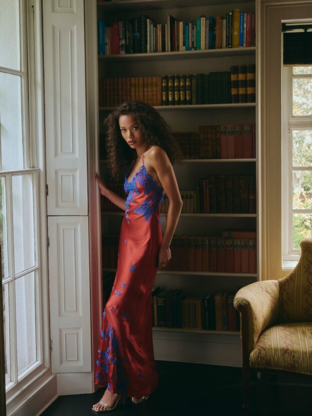 Torlowei’s Fall/Winter 2026 collection unveiled the Tokoni maxi slip dress, initially rendered in vivid burnt orange with bright blue lace trim before being reimagined in honey-mustard silk satin with black Leavers lace detailing