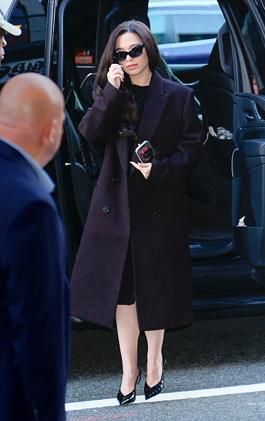 Mikey Madison was photographed in New York City during a press tour for the premiere of “The Social Reckoning,” dressed in an oversized double-breasted wool midi coat layered over a Ferragamo jersey dress and completed with Ferragamo “Dafne” 70 mm croc-embossed slingback pumps.